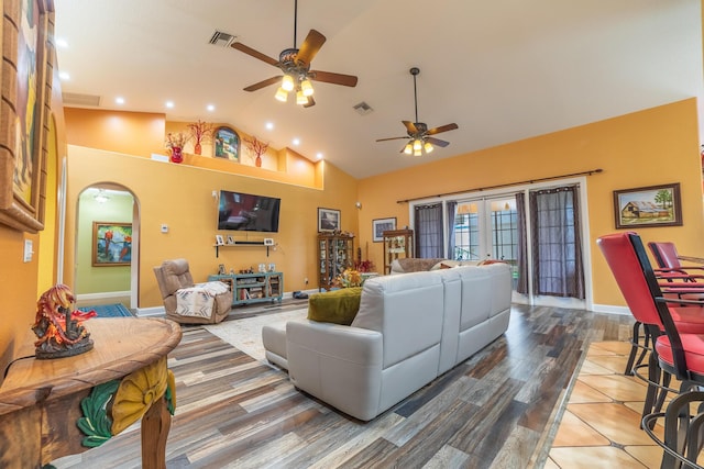 7611 SW 21st Pkwy, Okeechobee, FL 34974 - living area with ceiling fan, high vaulted ceiling, arched walkways, wood finished floors, and baseboards