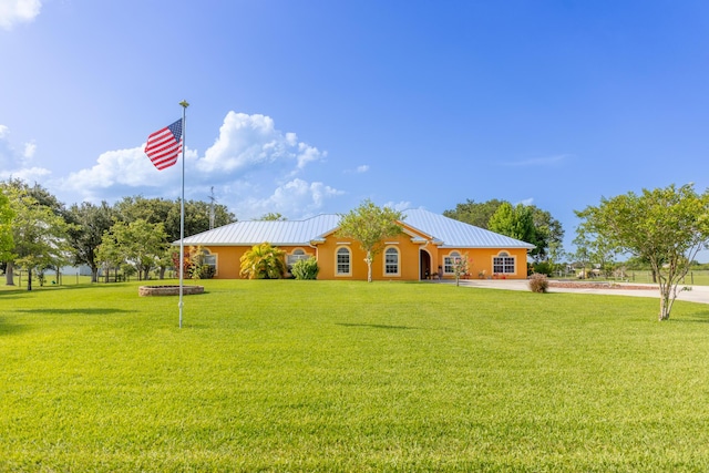 7611 SW 21st Pkwy, Okeechobee, FL 34974 - ranch-style home with a front yard and metal roof
