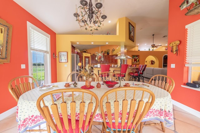 7611 SW 21st Pkwy, Okeechobee, FL 34974 - dining area with a chandelier, baseboards, a ceiling fan, and tile patterned floors