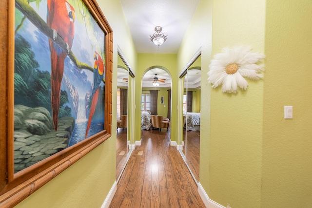 7611 SW 21st Pkwy, Okeechobee, FL 34974 - hallway with wood-type flooring, baseboards, and a textured wall
