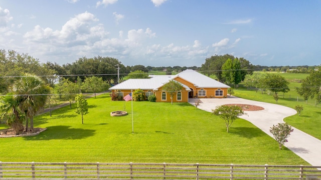 7611 SW 21st Pkwy, Okeechobee, FL 34974 - ranch-style home with curved driveway and metal roof