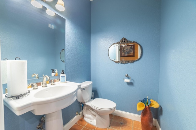 7611 SW 21st Pkwy, Okeechobee, FL 34974 - bathroom with tile patterned floors, toilet, and baseboards