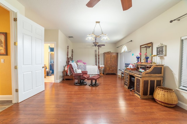 7611 SW 21st Pkwy, Okeechobee, FL 34974 - bedroom featuring wood-type flooring, baseboards, and a ceiling fan