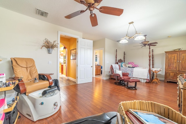 7611 SW 21st Pkwy, Okeechobee, FL 34974 - living room with ceiling fan, hardwood / wood-style floors, and baseboards
