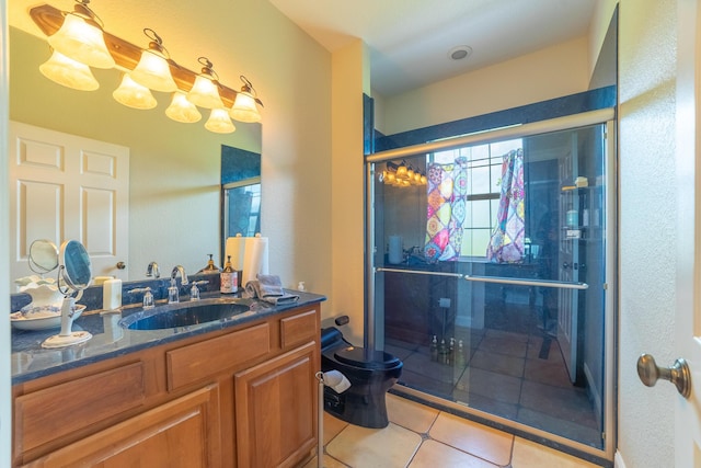 7611 SW 21st Pkwy, Okeechobee, FL 34974 - full bathroom with toilet, vanity, a shower stall, and tile patterned floors