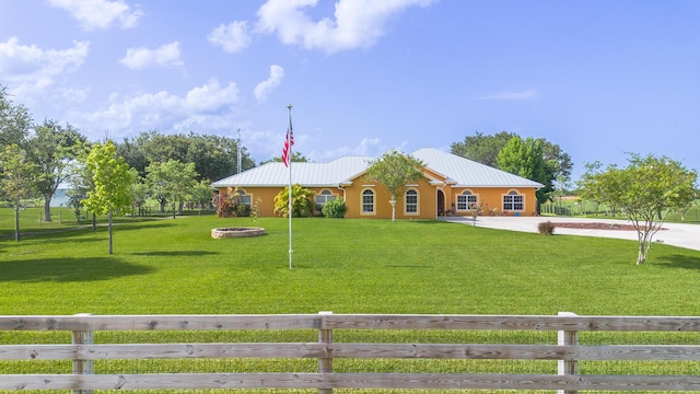7611 SW 21st Pkwy, Okeechobee, FL 34974 - ranch-style home featuring concrete driveway and metal roof