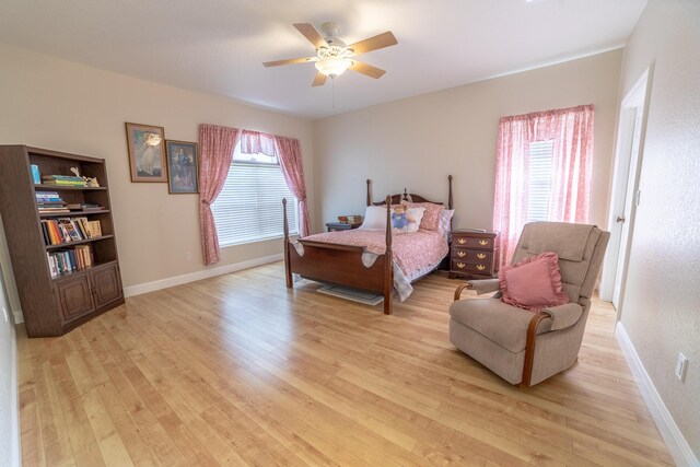 7611 SW 21st Pkwy, Okeechobee, FL 34974 - bedroom with light wood-style floors, multiple windows, and baseboards