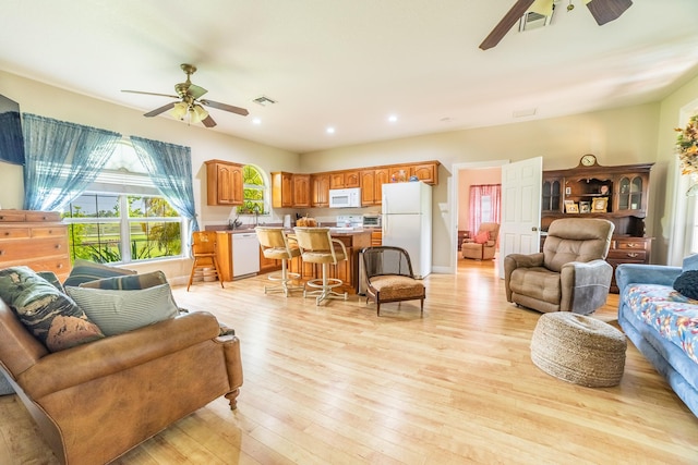 7611 SW 21st Pkwy, Okeechobee, FL 34974 - living area featuring a ceiling fan, light wood-type flooring, and recessed lighting