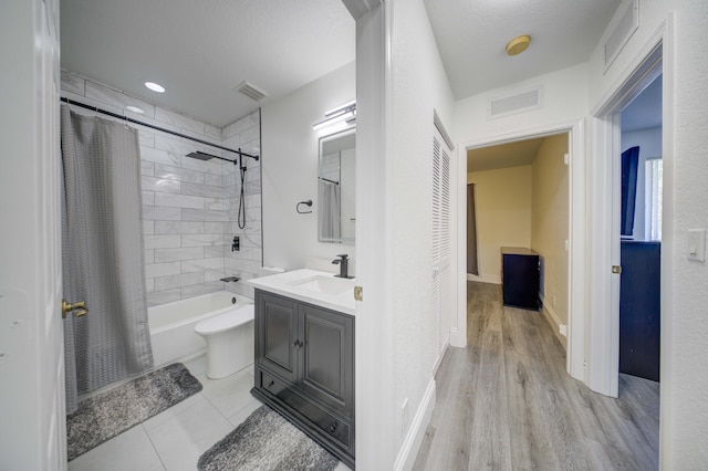 2364 Center Stone Ln, Riviera Beach, FL 33404 - full bath with vanity, shower / tub combo, wood finished floors, and baseboards