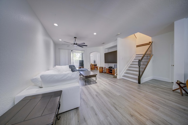 2364 Center Stone Ln, Riviera Beach, FL 33404 - living room with arched walkways, stairs, wood finished floors, recessed lighting, and ceiling fan