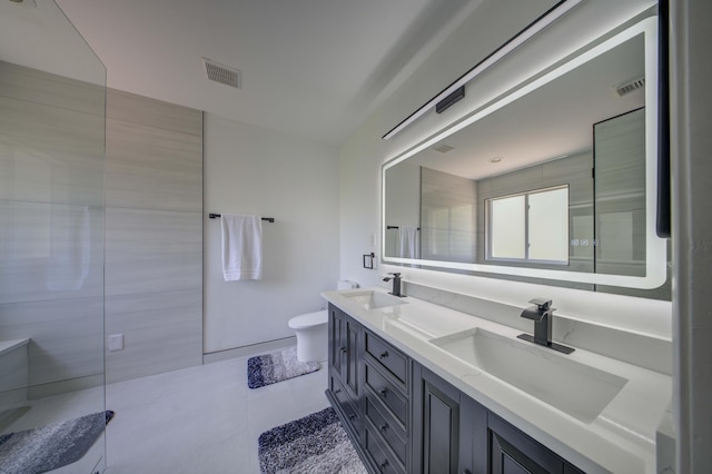 2364 Center Stone Ln, Riviera Beach, FL 33404 - full bath with toilet, double vanity, tile patterned floors, and an enclosed shower