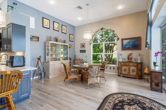 10312 Inverness Way, Port Saint Lucie, FL 34986 - dining space with baseboards, light wood-style floors, a chandelier, and recessed lighting