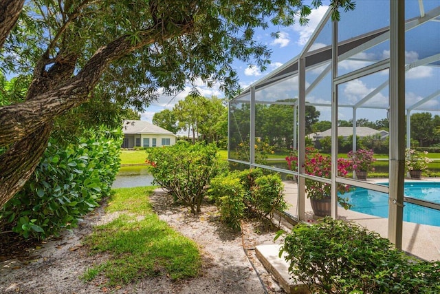 10312 Inverness Way, Port Saint Lucie, FL 34986 - view of yard with an outdoor pool and glass enclosure