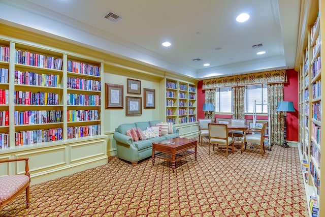 10312 Inverness Way, Port Saint Lucie, FL 34986 - living area with carpet flooring, ornamental molding, built in shelves, recessed lighting, and bookshelves