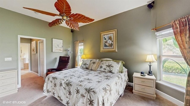 2127 NW Tilia Trl, Stuart, FL 34994 - bedroom featuring light carpet, multiple windows, and baseboards