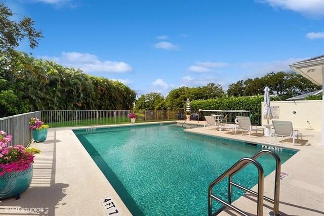 2127 NW Tilia Trl, Stuart, FL 34994 - community pool with a patio