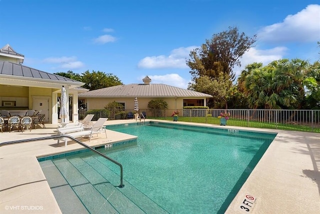 2127 NW Tilia Trl, Stuart, FL 34994 - community pool featuring a patio area