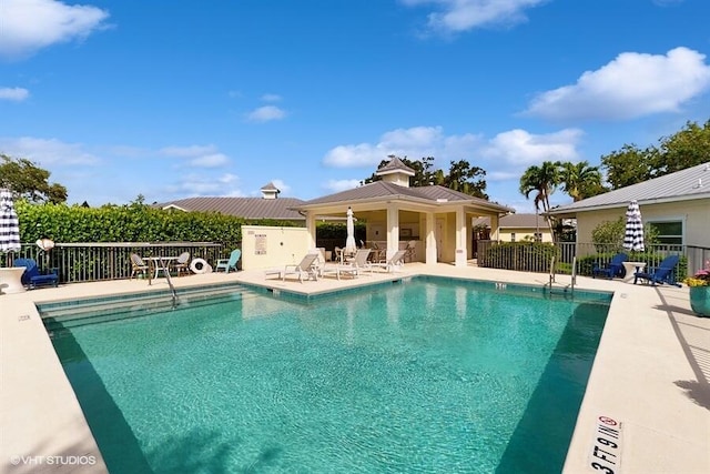 2127 NW Tilia Trl, Stuart, FL 34994 - community pool featuring a patio and a gazebo