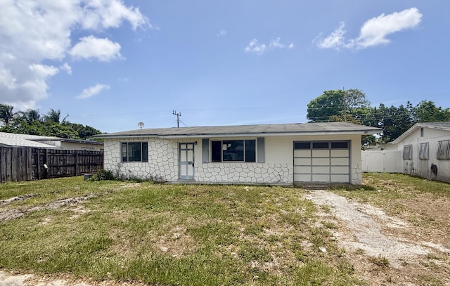 1376 Meadowbrook Dr, West Palm Beach, FL 33417 - back of house with driveway and a garage