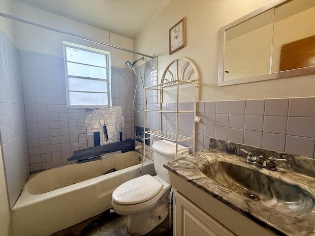 1376 Meadowbrook Dr, West Palm Beach, FL 33417 - full bathroom featuring tile walls, toilet, vanity, tub / shower combination, and wainscoting