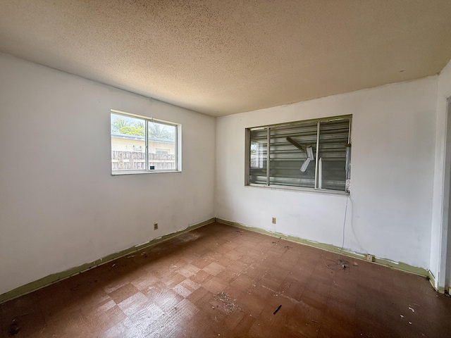 1376 Meadowbrook Dr, West Palm Beach, FL 33417 - empty room with a textured ceiling and baseboards