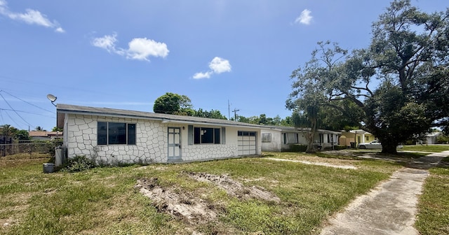 1376 Meadowbrook Dr, West Palm Beach, FL 33417 - ranch-style house with stone siding and a garage