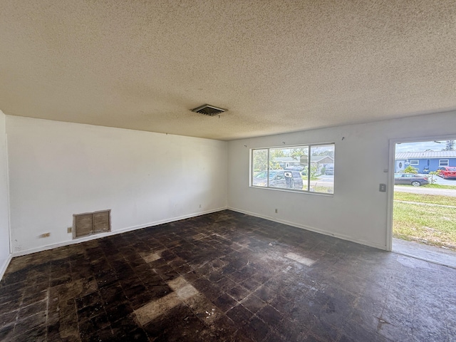 1376 Meadowbrook Dr, West Palm Beach, FL 33417 - unfurnished room with a textured ceiling and baseboards
