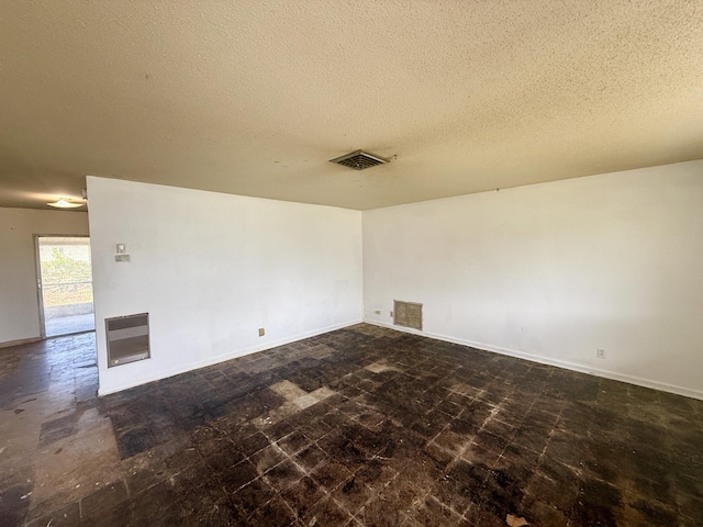 1376 Meadowbrook Dr, West Palm Beach, FL 33417 - spare room featuring a textured ceiling and baseboards