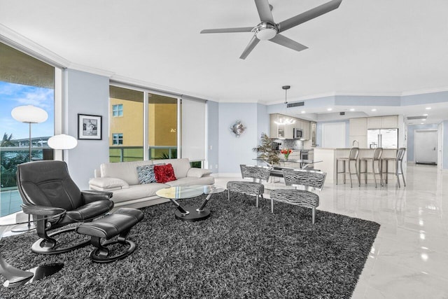 2650 Lake Shore Dr Unit 406, Riviera Beach, FL 33404 - living area with ornamental molding, ceiling fan, and expansive windows