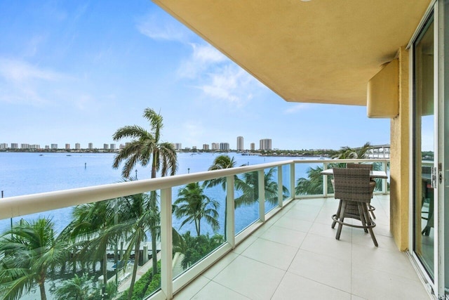 2650 Lake Shore Dr Unit 406, Riviera Beach, FL 33404 - balcony with a skyline view and a water view