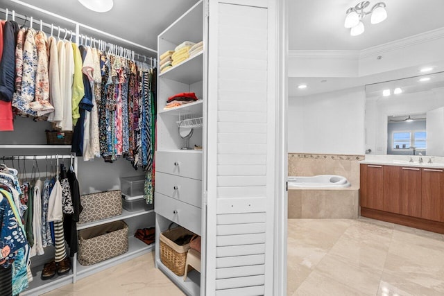2650 Lake Shore Dr Unit 406, Riviera Beach, FL 33404 - spacious closet with a sink and light marble finish floors