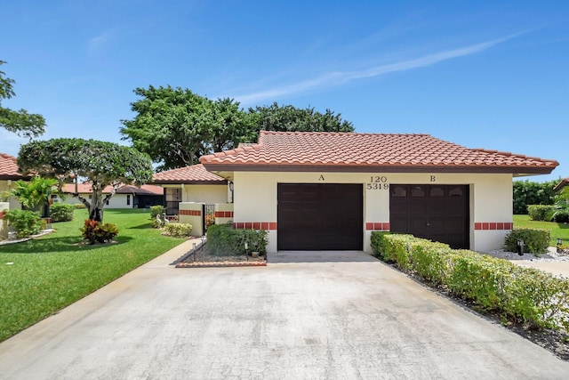 5319 Palmetto Palm Ct Unit A, Boynton Beach, FL 33437 - mediterranean / spanish-style house featuring a front lawn, concrete driveway, a garage, stucco siding, and a tiled roof
