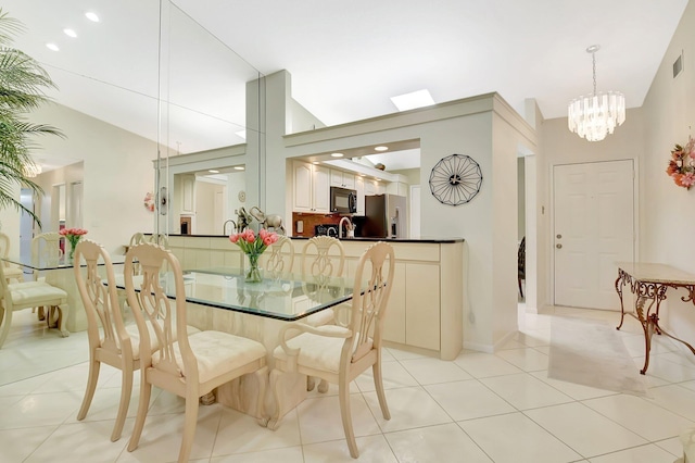 5319 Palmetto Palm Ct Unit A, Boynton Beach, FL 33437 - dining room featuring vaulted ceiling, a chandelier, and light tile patterned floors