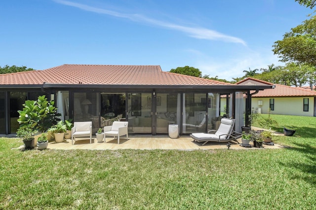 5319 Palmetto Palm Ct Unit A, Boynton Beach, FL 33437 - back of house featuring a tiled roof, a yard, and a patio