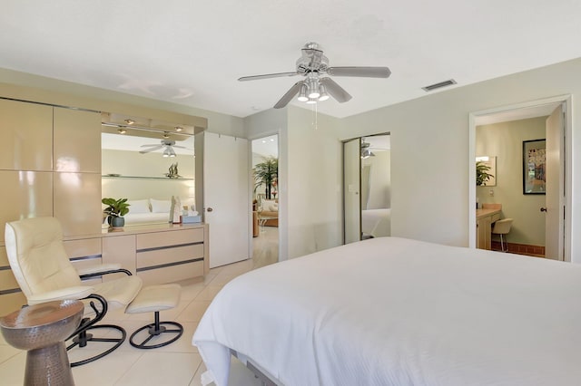 5319 Palmetto Palm Ct Unit A, Boynton Beach, FL 33437 - bedroom with light tile patterned floors, a desk, connected bathroom, and ceiling fan