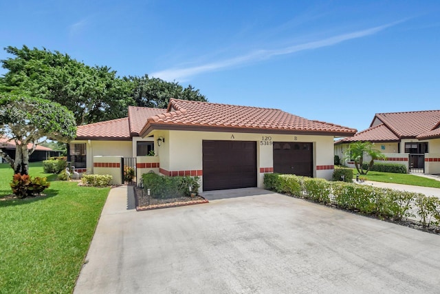 5319 Palmetto Palm Ct Unit A, Boynton Beach, FL 33437 - mediterranean / spanish house with a tile roof, a front yard, a garage, stucco siding, and concrete driveway