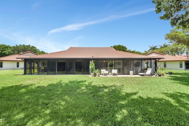 5319 Palmetto Palm Ct Unit A, Boynton Beach, FL 33437 - back of house with a sunroom, a lawn, and a tile roof