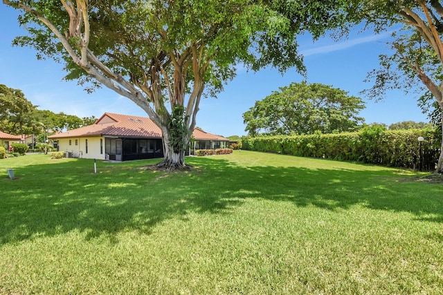 5319 Palmetto Palm Ct Unit A, Boynton Beach, FL 33437 - view of green lawn with a sunroom