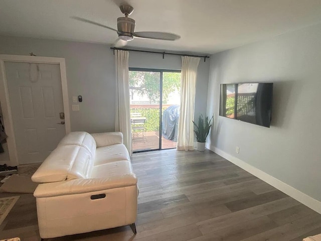 637 Executive Center Dr Unit N207, West Palm Beach, FL 33401 - living room with wood finished floors, a ceiling fan, and baseboards