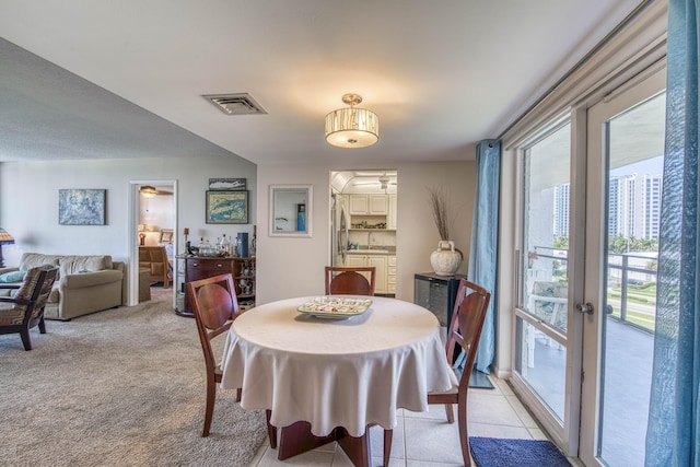 336 Golfview Rd Unit 518, North Palm Beach, FL 33408 - dining space with healthy amount of natural light and light colored carpet