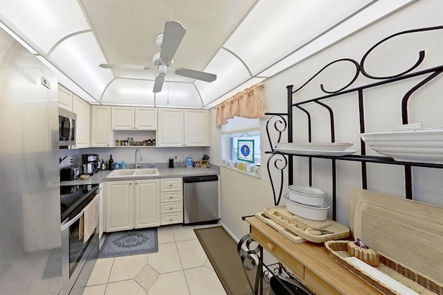 336 Golfview Rd Unit 518, North Palm Beach, FL 33408 - kitchen featuring appliances with stainless steel finishes, a sink, open shelves, a ceiling fan, and light tile patterned floors