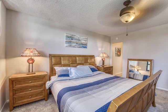 336 Golfview Rd Unit 518, North Palm Beach, FL 33408 - bedroom featuring light carpet, a textured ceiling, baseboards, and ceiling fan