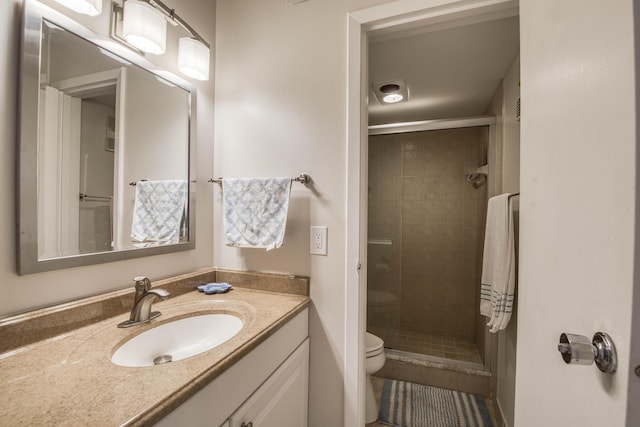 336 Golfview Rd Unit 518, North Palm Beach, FL 33408 - full bath featuring a stall shower, toilet, vanity, and tile patterned flooring