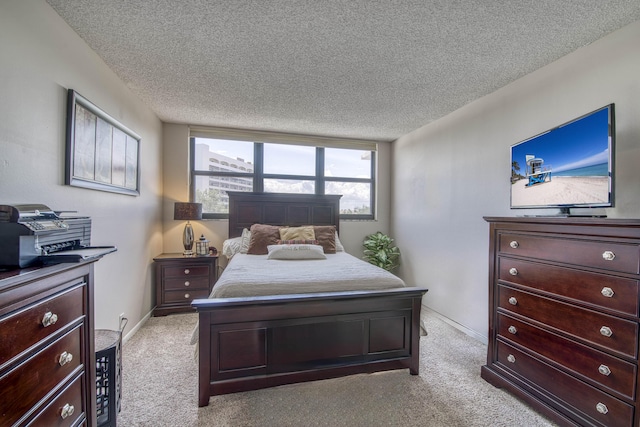 336 Golfview Rd Unit 518, North Palm Beach, FL 33408 - bedroom with light colored carpet, a textured ceiling, and baseboards