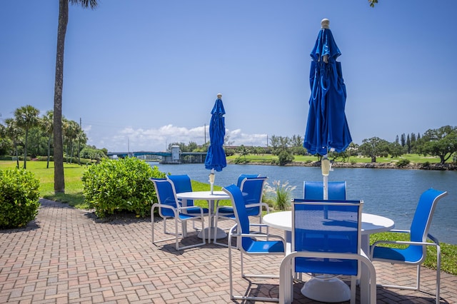 336 Golfview Rd Unit 518, North Palm Beach, FL 33408 - view of patio with a water view and outdoor dining space