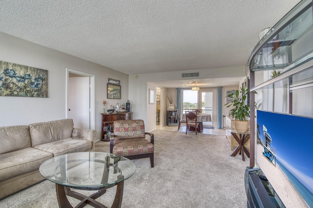 336 Golfview Rd Unit 518, North Palm Beach, FL 33408 - living area with a textured ceiling and light colored carpet