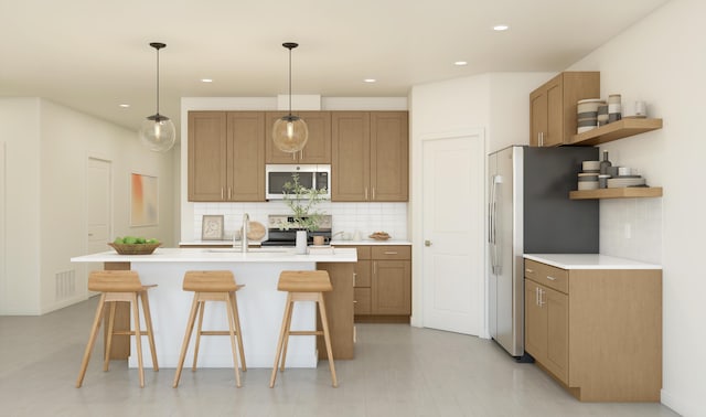4572 SW Savona Blvd Unit 16, Port Saint Lucie, FL 34953 - kitchen with stainless steel microwave, freestanding refrigerator, open shelves, a kitchen breakfast bar, and backsplash