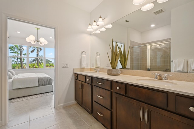 12755 SW Cattleya Ln Unit 224, Port Saint Lucie, FL 34987 - bathroom with double vanity, a stall shower, tile patterned flooring, and ensuite bathroom