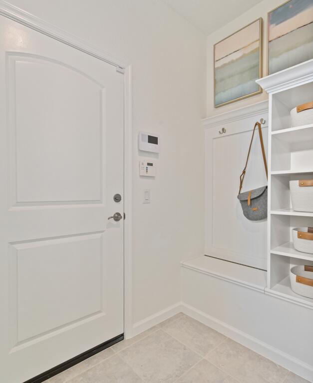 12755 SW Cattleya Ln Unit 224, Port Saint Lucie, FL 34987 - mudroom featuring light tile patterned floors and baseboards