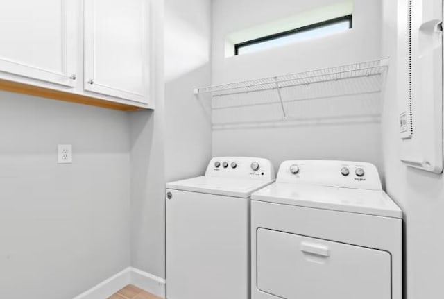 12755 SW Cattleya Ln Unit 224, Port Saint Lucie, FL 34987 - laundry area with washing machine and clothes dryer, cabinet space, and baseboards